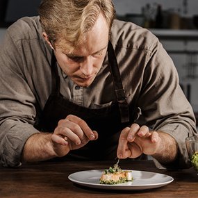 Chef plating a dish